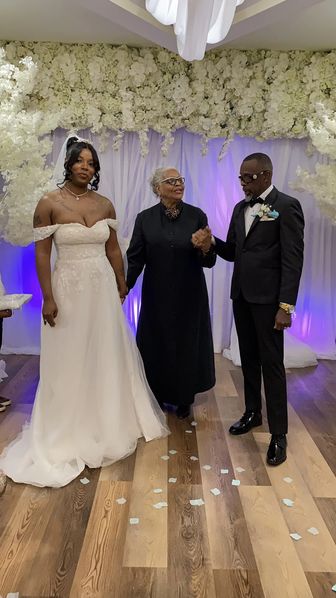 Bride and groom with their officiant