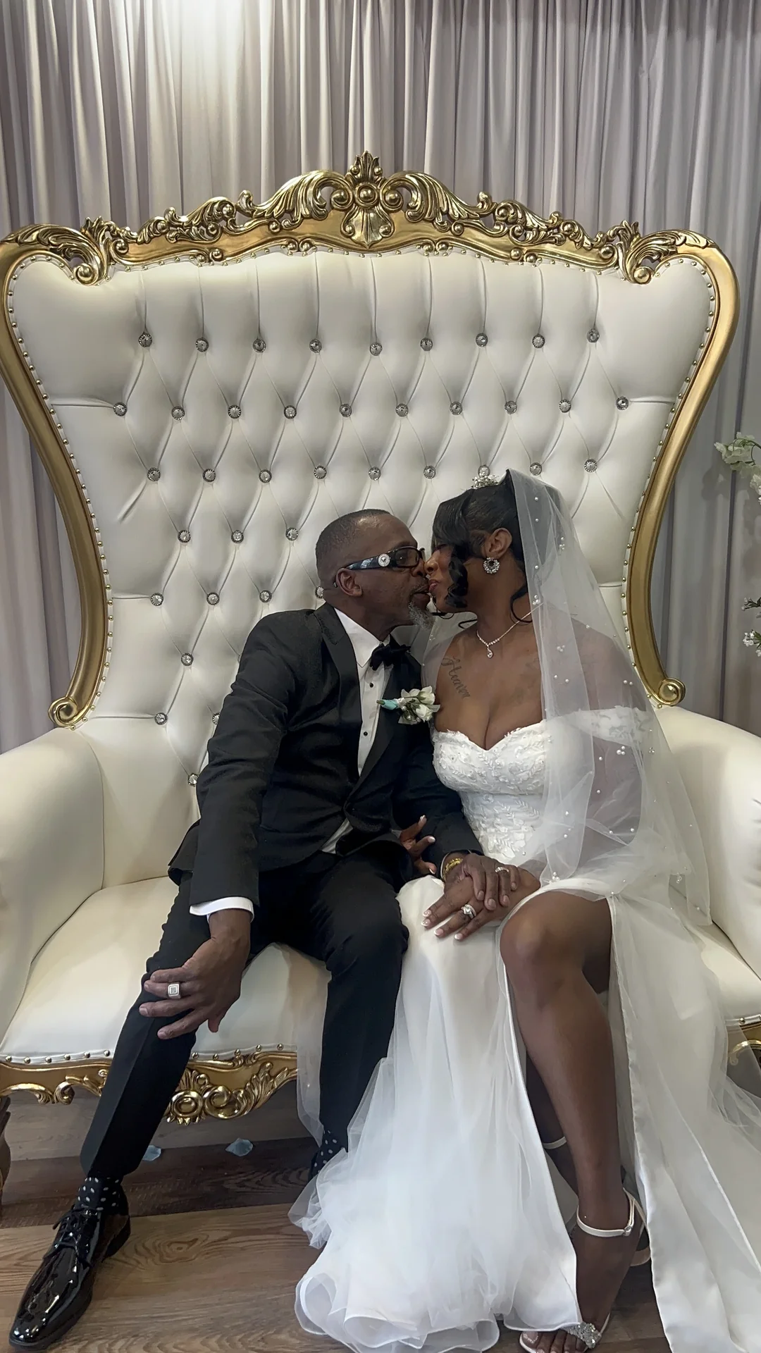 Newlyweds on the throne chairs