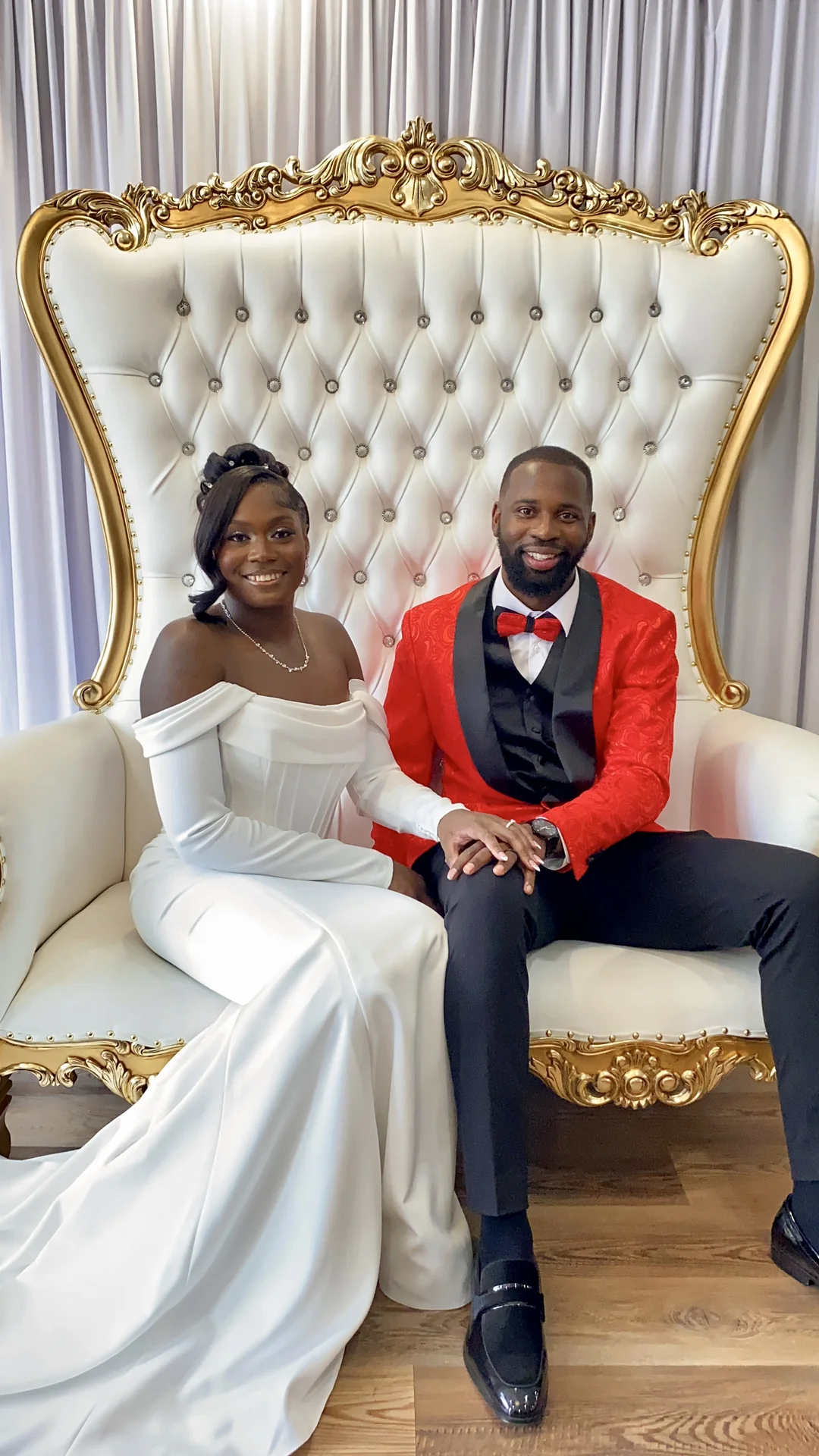 Newlyweds on the throne chairs